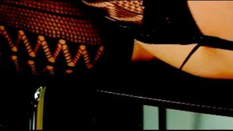 Deep throating a brunette with fishnets on