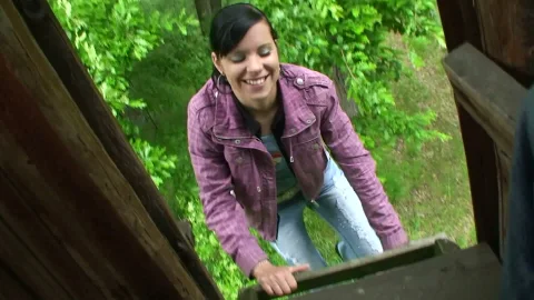 Young girl takes full load outside